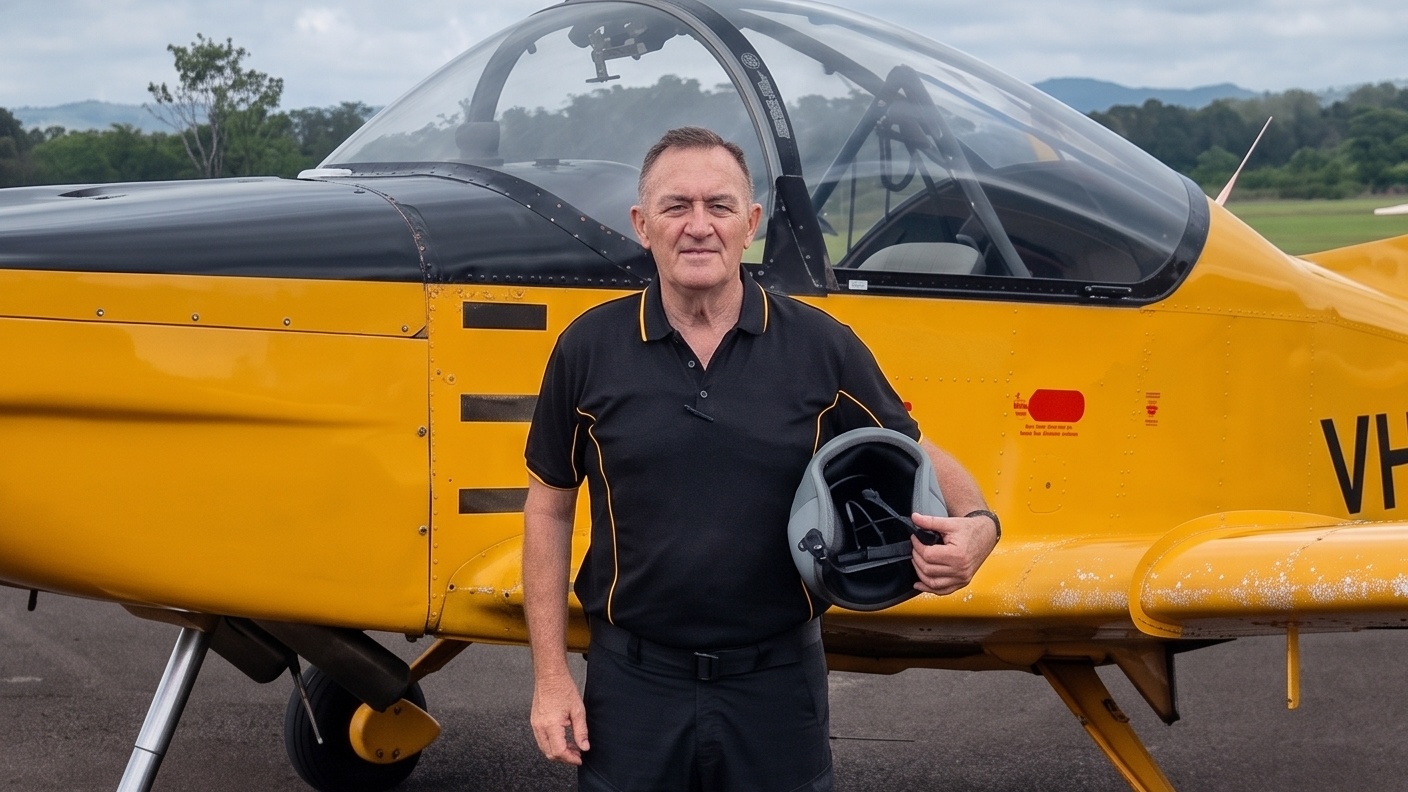 John Anderson, Founder of Anderson Aviation, standing beside an aircraft